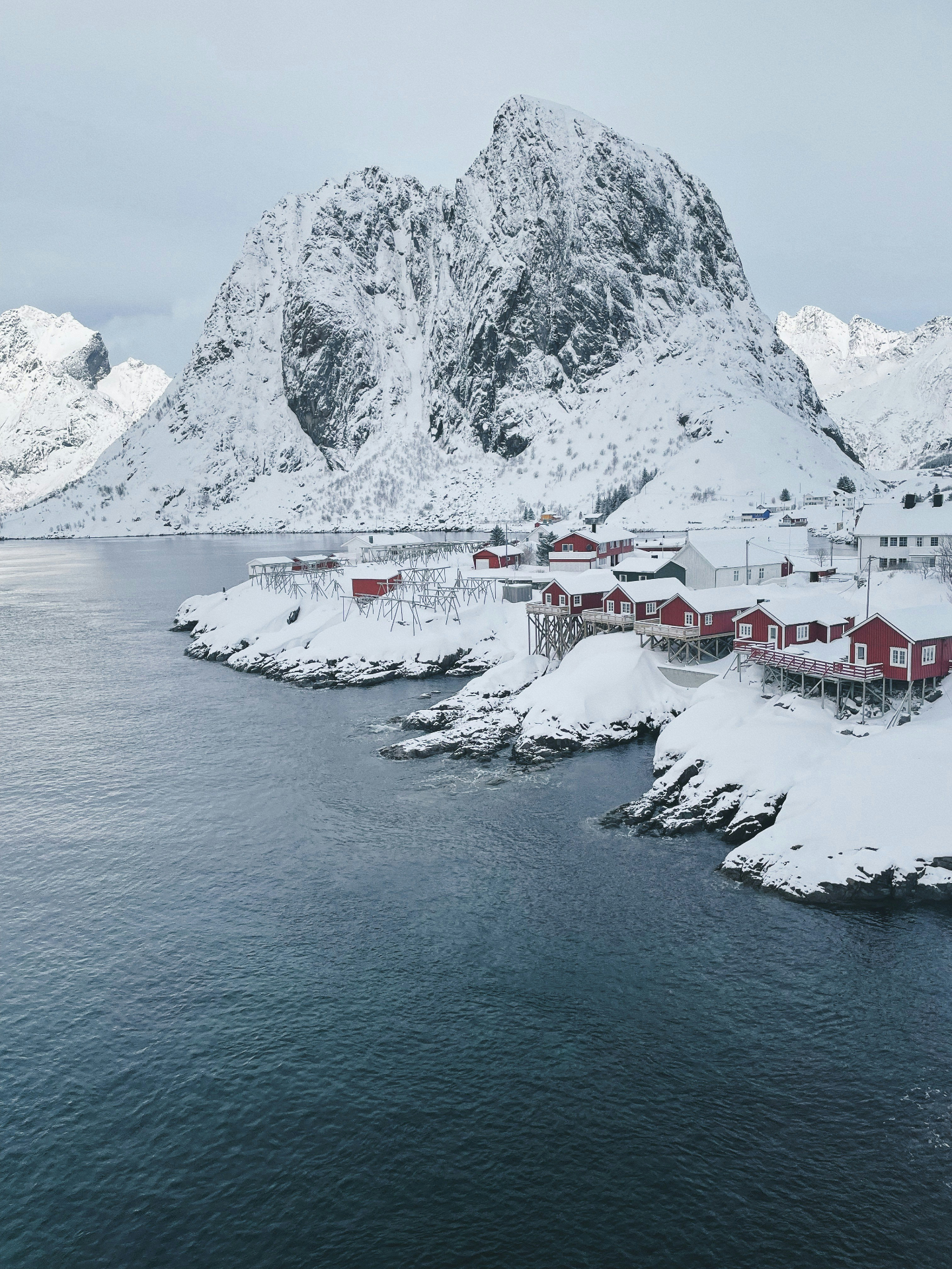 Hamnøy, Lofoten — red cabins beneath snowy peaks