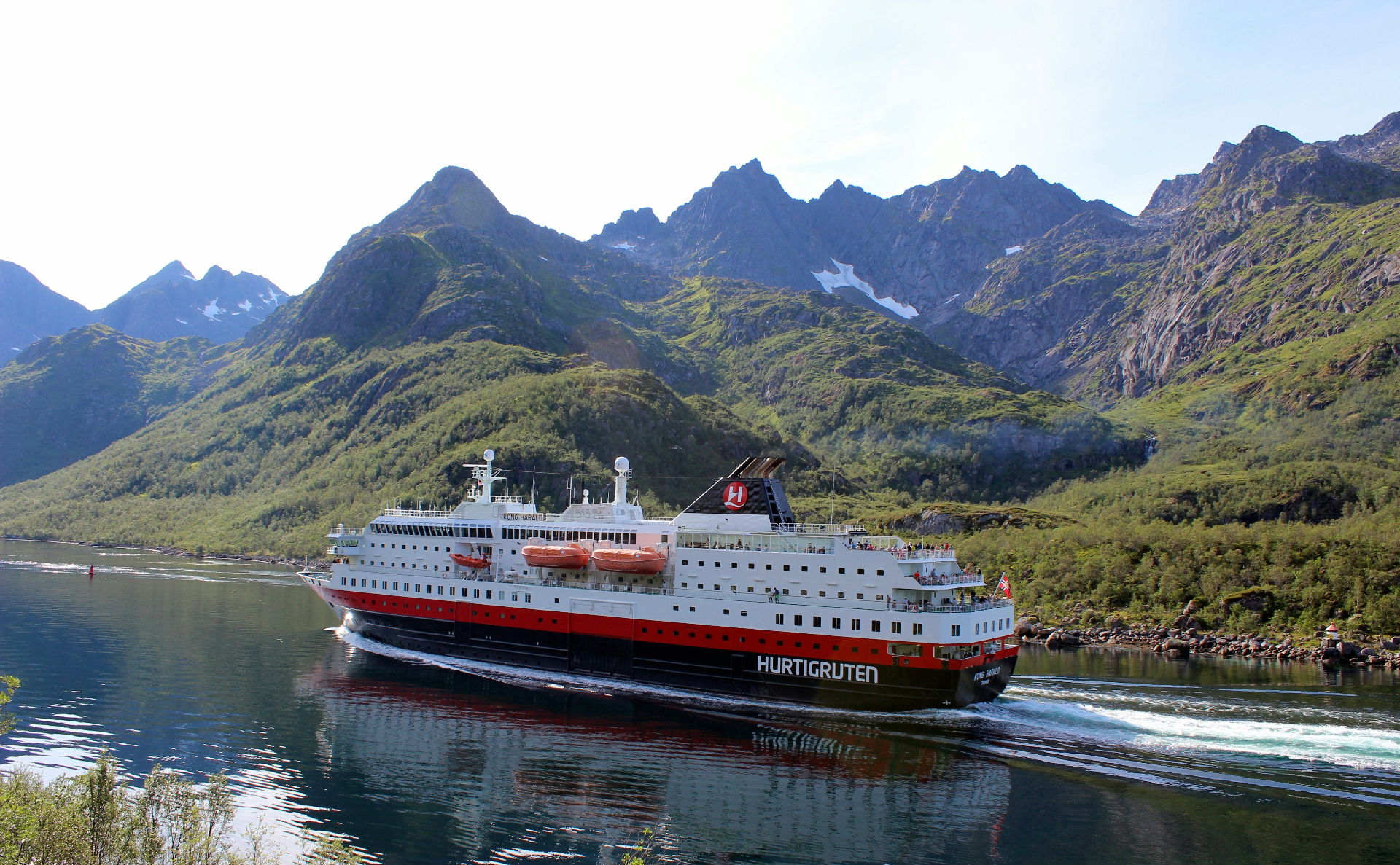 Hurtigruten ship cruising a Norwegian fjord
